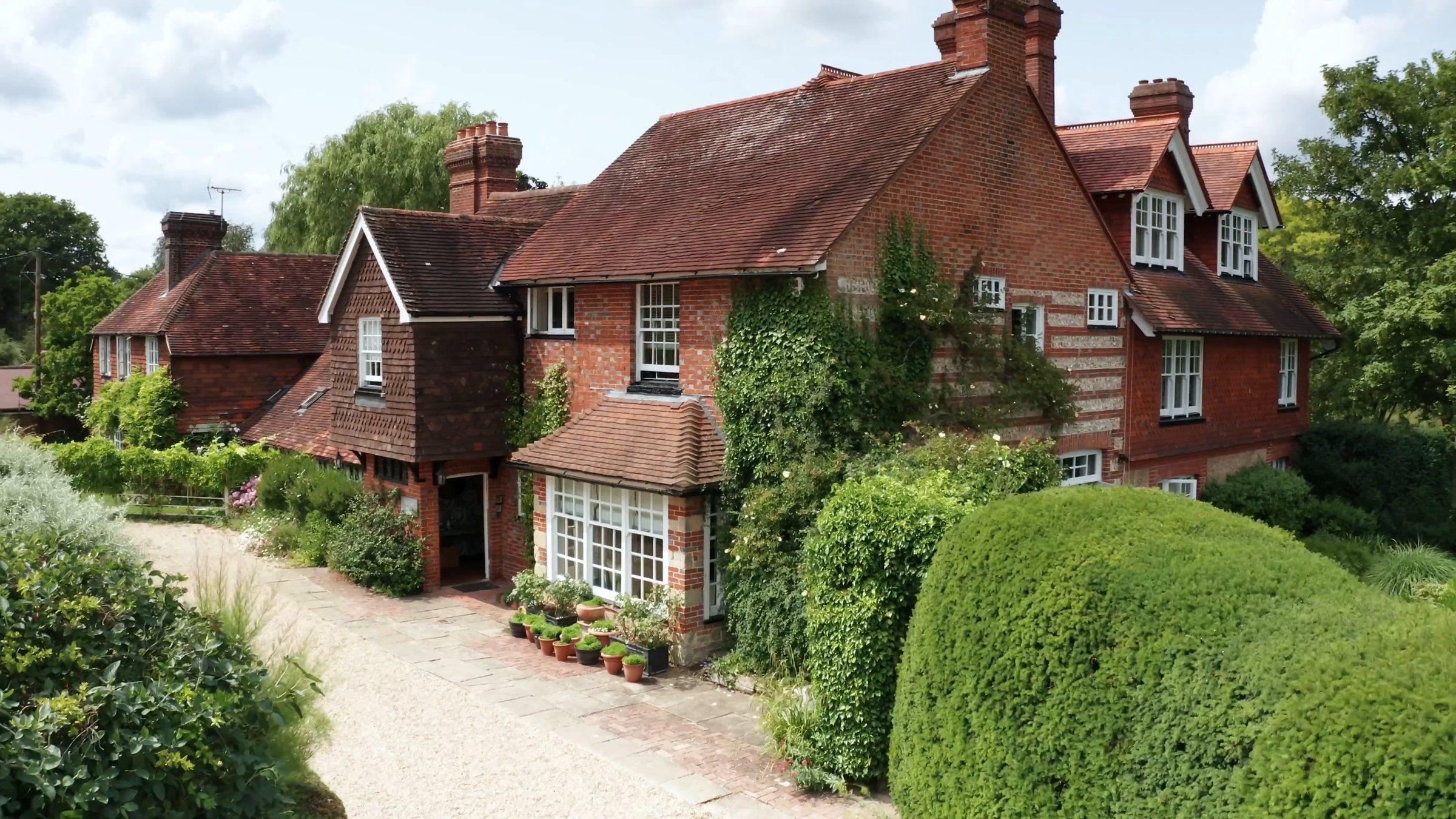 Balneath Manor and its drive from above the hedges